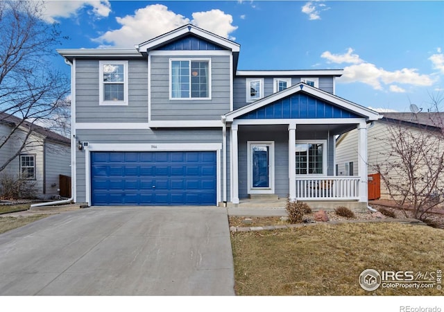 view of front of house with board and batten siding, covered porch, an attached garage, and concrete driveway