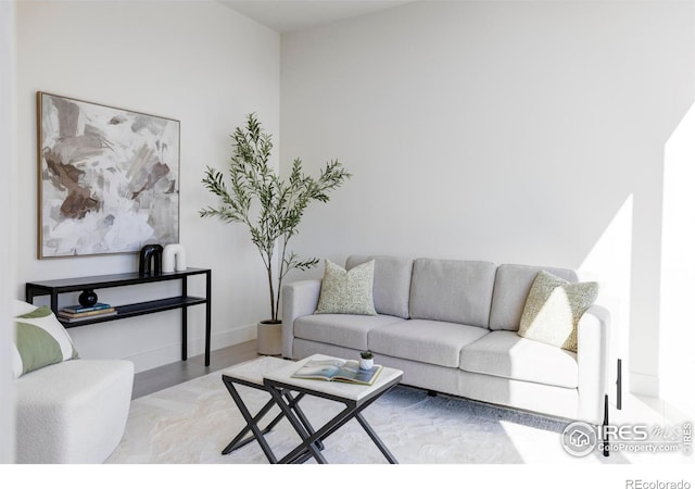 living room with wood finished floors and baseboards