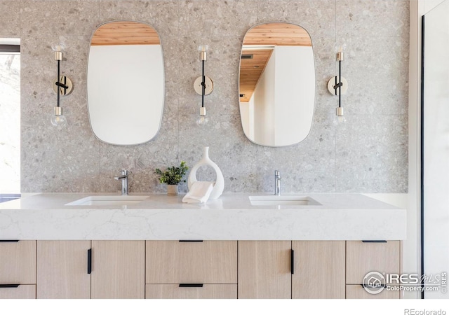 full bath featuring double vanity and a sink