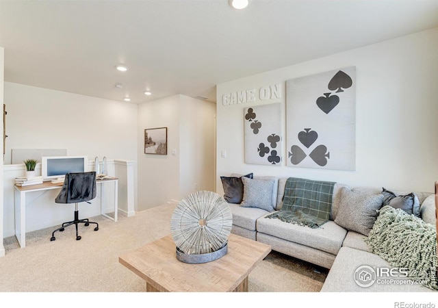 carpeted living area with recessed lighting