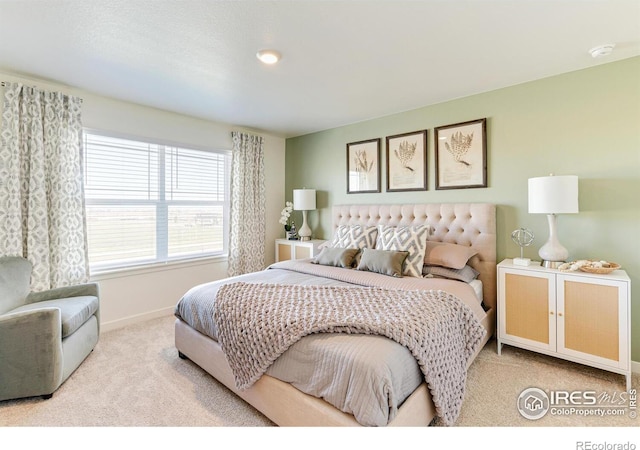 carpeted bedroom with baseboards