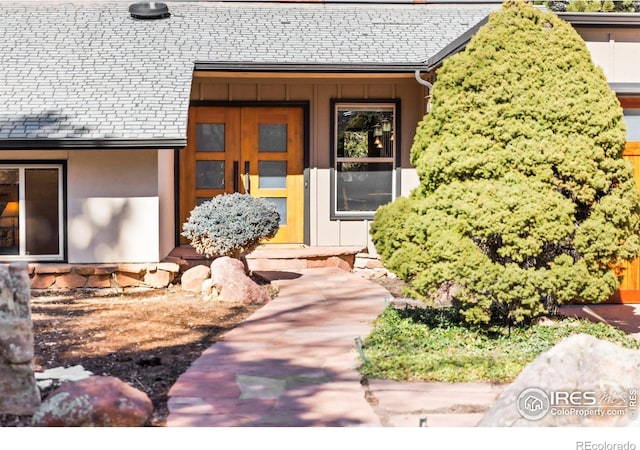 entrance to property featuring a high end roof