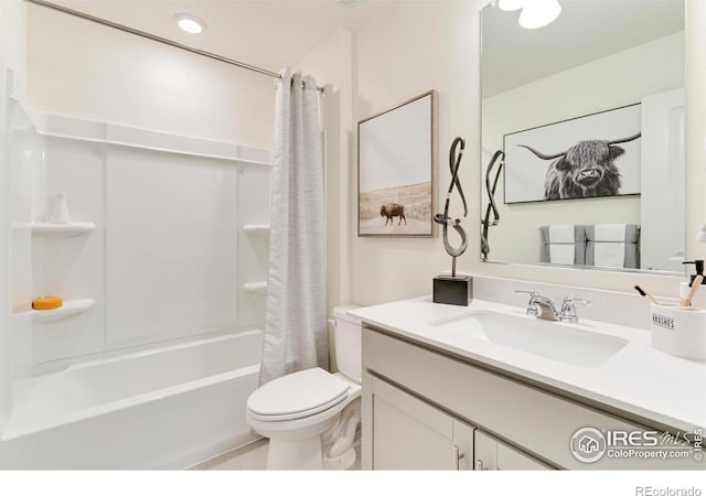 bathroom featuring shower / bath combo, vanity, toilet, and tile patterned floors