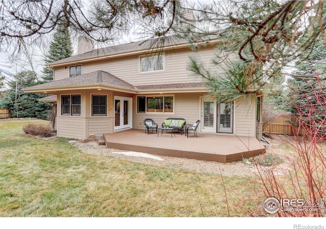 back of house with a patio, fence, a yard, french doors, and a chimney