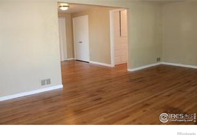 606 Sheldon Dr, Fort Collins, CO 80521 - empty room featuring baseboards and wood finished floors