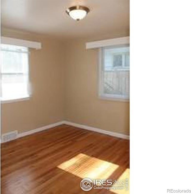 606 Sheldon Dr, Fort Collins, CO 80521 - spare room featuring baseboards and wood finished floors