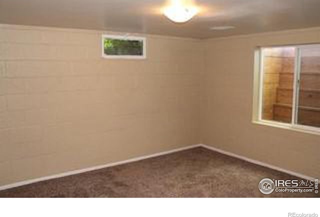606 Sheldon Dr, Fort Collins, CO 80521 - empty room featuring dark colored carpet and baseboards
