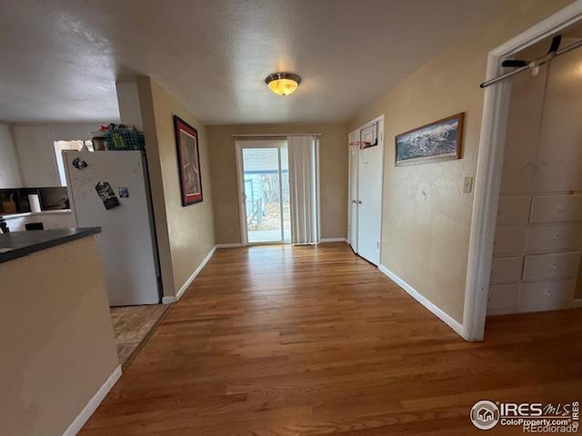 606 Sheldon Dr, Fort Collins, CO 80521 - hall featuring light wood-type flooring and baseboards