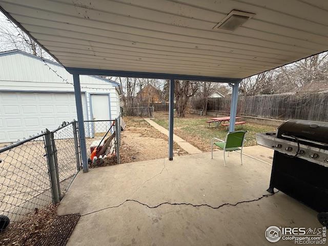 606 Sheldon Dr, Fort Collins, CO 80521 - fenced backyard with an outbuilding, a grill, a garage, and a patio area