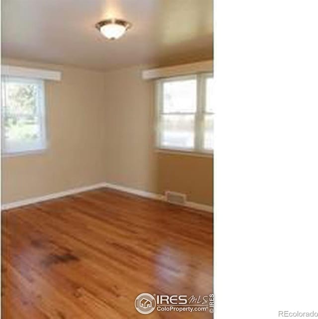 606 Sheldon Dr, Fort Collins, CO 80521 - empty room featuring baseboards and wood finished floors