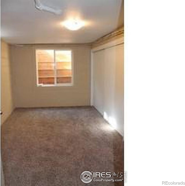 606 Sheldon Dr, Fort Collins, CO 80521 - unfurnished bedroom with a closet and carpet flooring