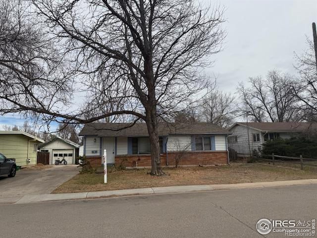 606 Sheldon Dr, Fort Collins, CO 80521 - ranch-style home with an outdoor structure, brick siding, driveway, and a detached garage