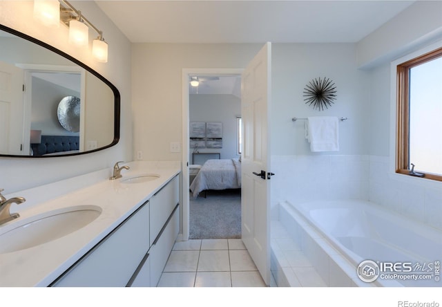 2425 Waneka Lake Trl, Lafayette, CO 80026 - bathroom featuring ensuite bath, double vanity, a garden tub, tile patterned flooring, and healthy amount of natural light