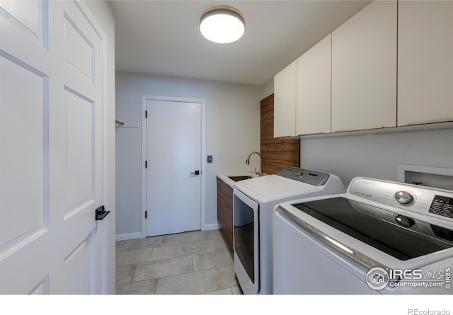 2425 Waneka Lake Trl, Lafayette, CO 80026 - washroom featuring cabinet space, independent washer and dryer, and baseboards