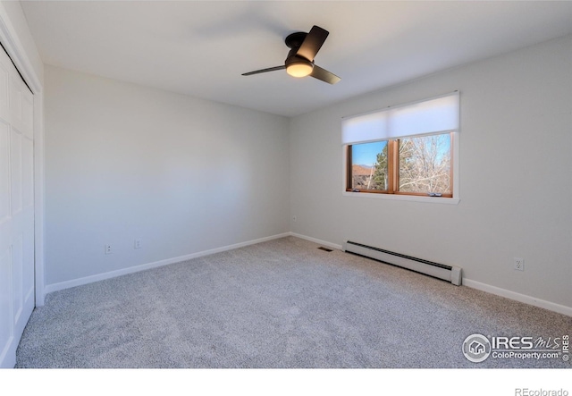 2425 Waneka Lake Trl, Lafayette, CO 80026 - unfurnished bedroom featuring a baseboard heating unit, carpet flooring, a closet, baseboards, and ceiling fan