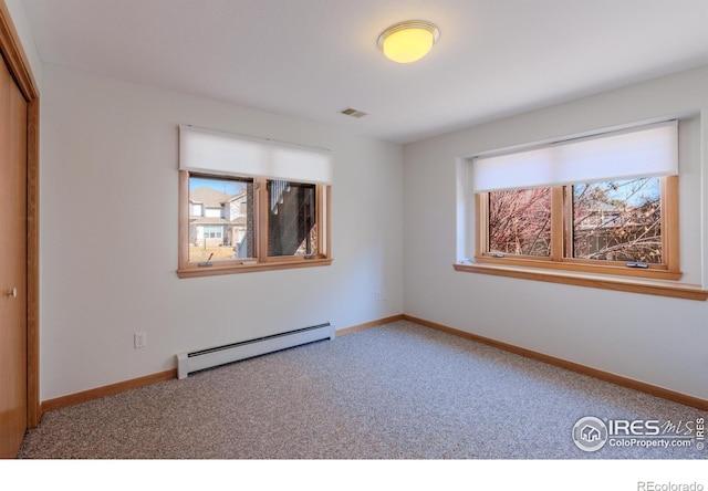 2425 Waneka Lake Trl, Lafayette, CO 80026 - empty room with baseboard heating, carpet flooring, and baseboards