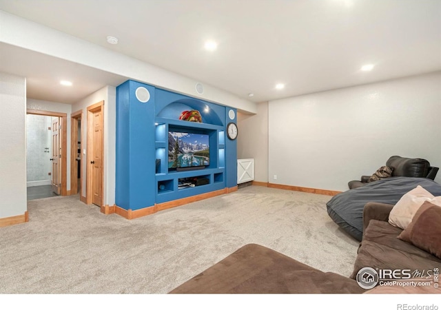 living area with carpet, baseboards, and recessed lighting