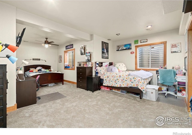 bedroom featuring a ceiling fan, carpet, and baseboards