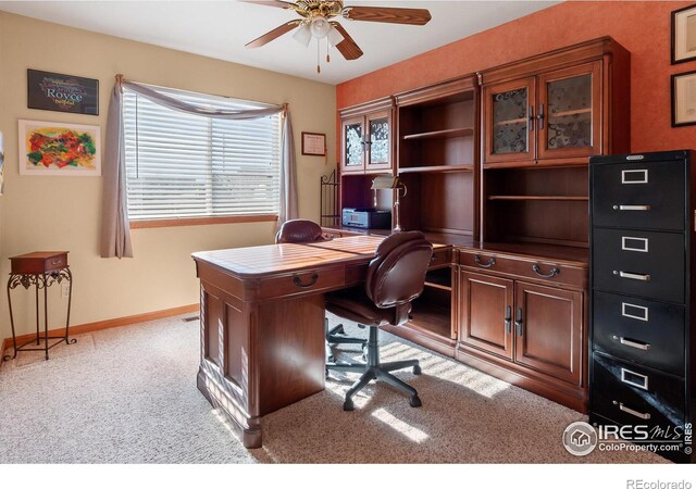 home office with ceiling fan, carpet flooring, and baseboards