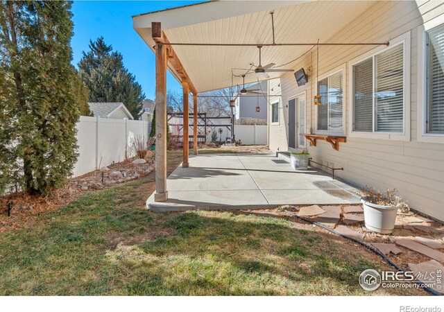 view of patio featuring ceiling fan and a fenced backyard