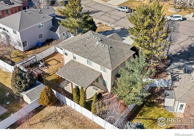 birds eye view of property with a residential view