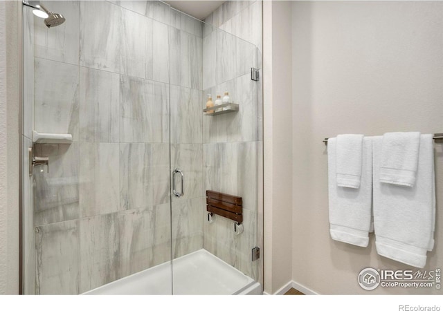 bathroom featuring a shower stall