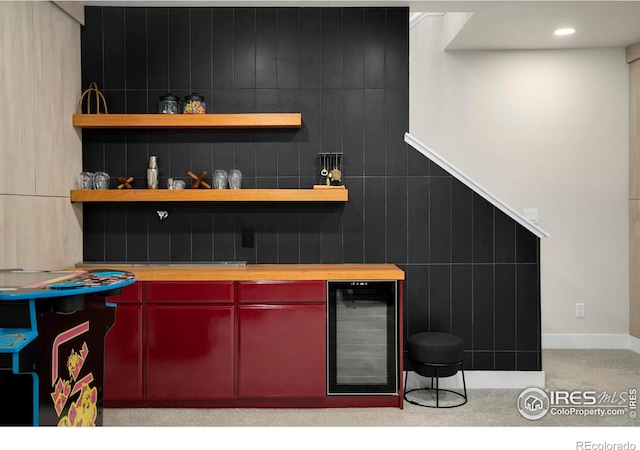 bar featuring wine cooler, a dry bar, and recessed lighting