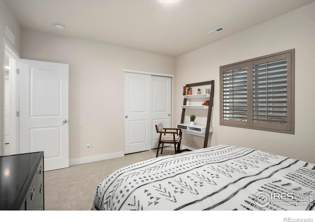 bedroom with carpet floors, baseboards, visible vents, and a closet