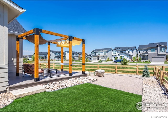 view of yard featuring a residential view, a patio, and fence