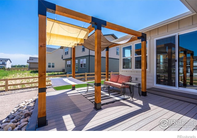 wooden deck featuring a pergola