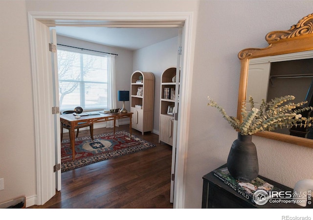 home office with wood finished floors