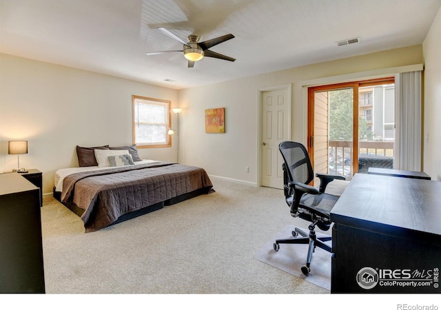 carpeted bedroom with access to exterior, visible vents, baseboards, and a ceiling fan