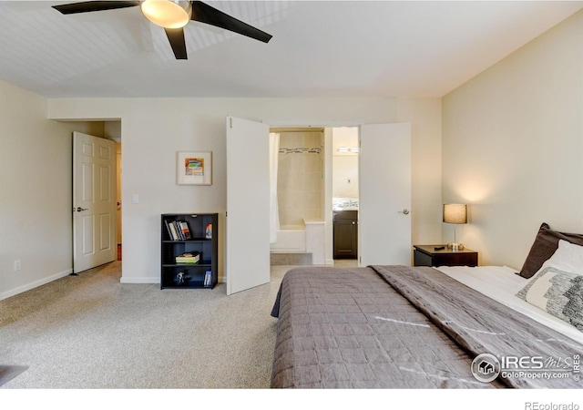 bedroom with ceiling fan, carpet, ensuite bath, and baseboards