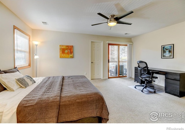 bedroom featuring access to outside, visible vents, ceiling fan, and carpet