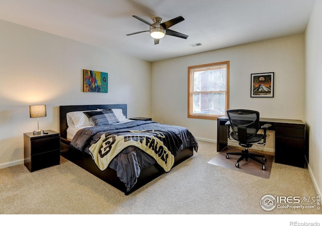 bedroom featuring ceiling fan, carpet, visible vents, and baseboards