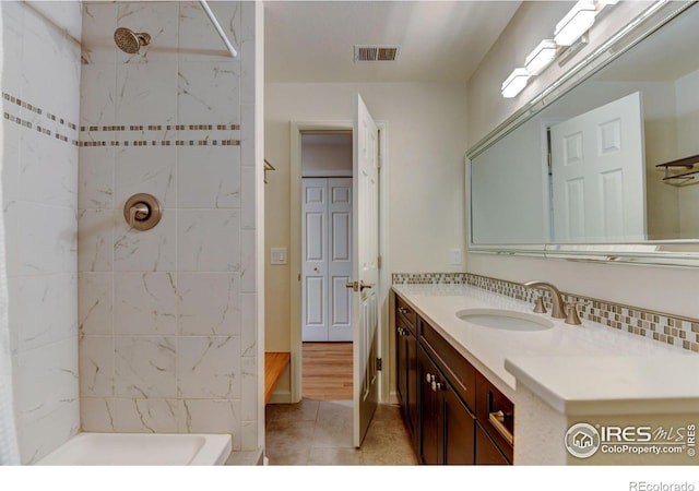 bathroom with visible vents and vanity