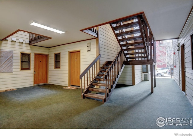 interior space with carpet and stairs