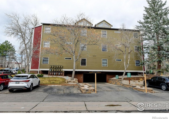 view of property with uncovered parking