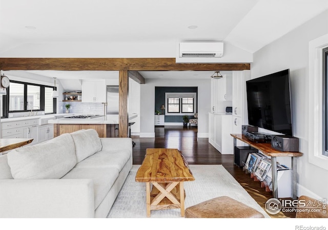 living room featuring dark wood-style floors, lofted ceiling, a wall mounted air conditioner, and baseboards