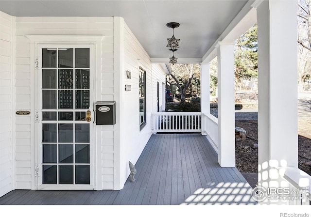 wooden deck featuring covered porch