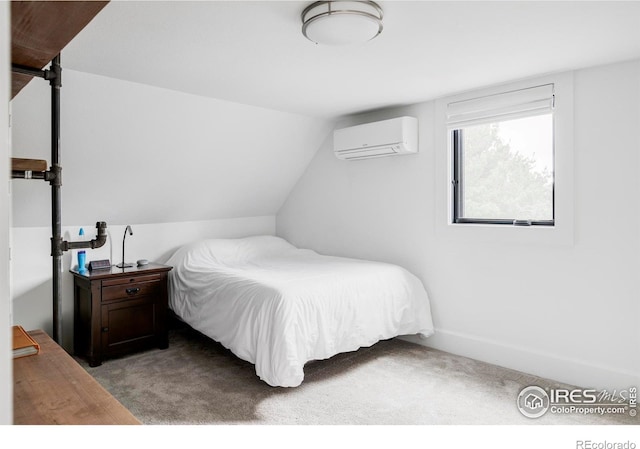 bedroom featuring lofted ceiling, a wall mounted air conditioner, and light colored carpet