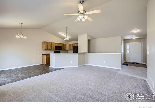 unfurnished living room with ceiling fan with notable chandelier, baseboards, dark carpet, and high vaulted ceiling