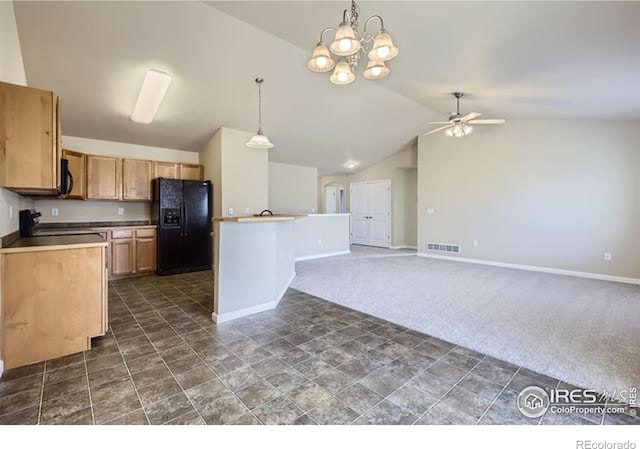 kitchen featuring visible vents, hanging light fixtures, black appliances, vaulted ceiling, and dark colored carpet