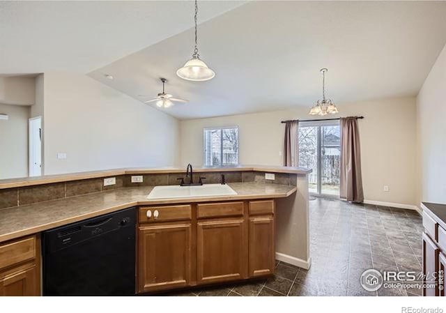 kitchen featuring lofted ceiling, black dishwasher, hanging light fixtures, brown cabinetry, and a sink