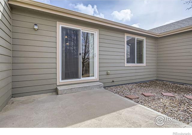 doorway to property featuring a patio