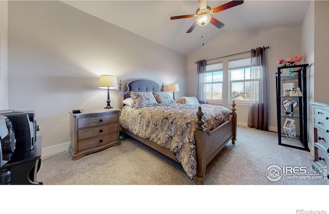 bedroom featuring a ceiling fan, light carpet, vaulted ceiling, and baseboards