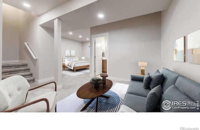 carpeted living room with stairs, recessed lighting, and baseboards