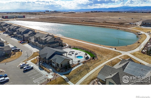 birds eye view of property with a mountain view