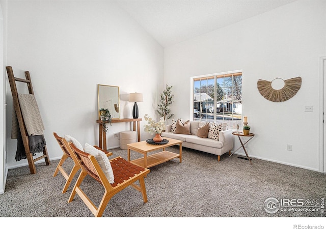 carpeted living room featuring high vaulted ceiling and baseboards