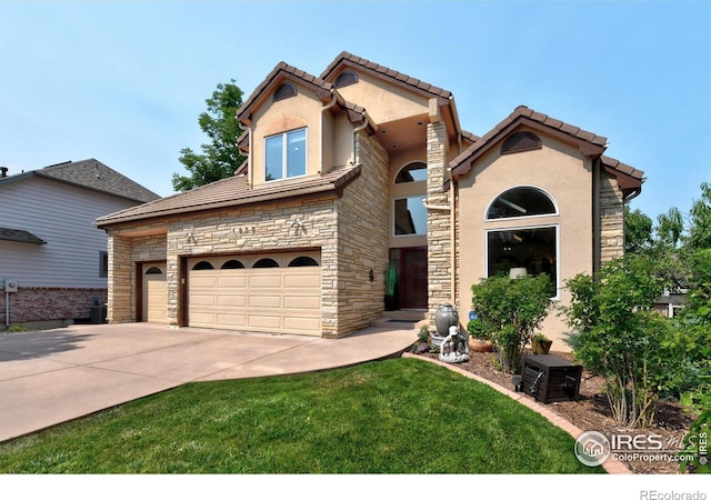 view of front of home with stone siding, a front lawn, concrete driveway, and stucco siding